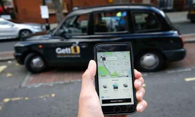 Aplicativo em Londres: ofensiva contra sistema de transporte tende a dificultar a tentativa de abertura do capital do Uber(foto: Daniel Leal-Olivas/AFP %u2013 22/9/17) Aplicativo em Londres: ofensiva contra sistema de transporte tende a dificultar a tentativa de abertura do capital do Uber(foto: Daniel Leal-Olivas/AFP %u2013 22/9/17)