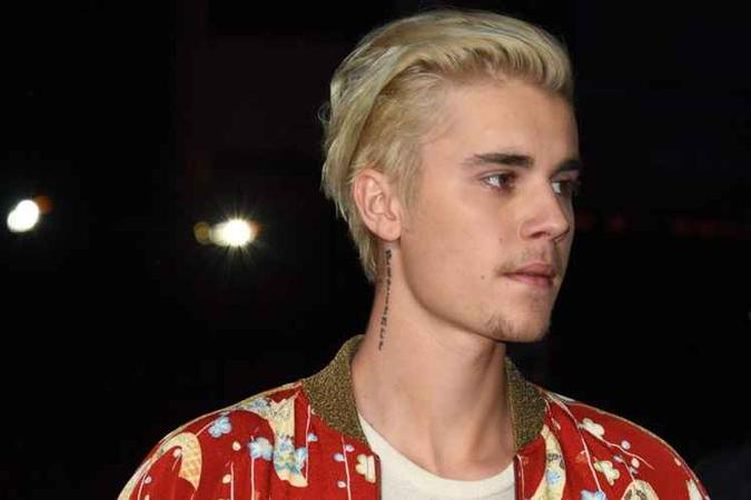 Justin Bieber começa a lançar músicas do novo projeto(foto: AFP/ROBYN BECK) Justin Bieber começa a lançar músicas do novo projeto(foto: AFP/ROBYN BECK)