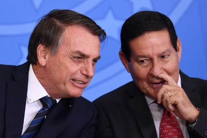 O presidente Jair Bolsonaro e o Vice Presidente General Hamilton Mourão em cerimônia no Palácio do Planalto(foto: EVARISTO SA) O presidente Jair Bolsonaro e o Vice Presidente General Hamilton Mourão em cerimônia no Palácio do Planalto(foto: EVARISTO SA)