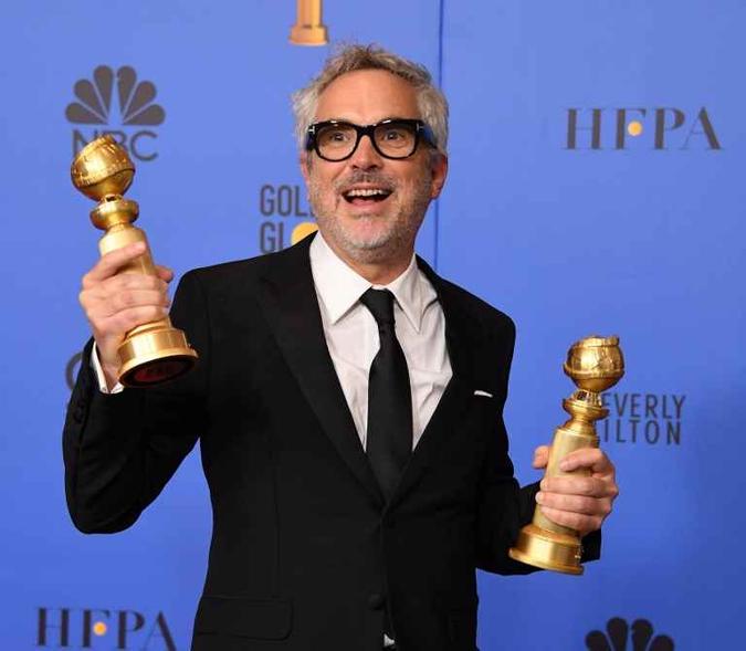 Quebrando paradigmas, Alfonso Cuarón levou dois troféus por 'Roma', uma produção original da Netflix(foto: Mark Ralston/AFP) Quebrando paradigmas, Alfonso Cuarón levou dois troféus por 'Roma', uma produção original da Netflix(foto: Mark Ralston/AFP)