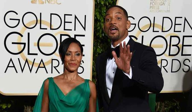 Will Smith posa para fotógrafos ao lado da esposa, Jada Pinkett Smith, no Golden Globe Awards(foto: AFP PHOTO / VALERIE MACON) Will Smith posa para fotógrafos ao lado da esposa, Jada Pinkett Smith, no Golden Globe Awards(foto: AFP PHOTO / VALERIE MACON)