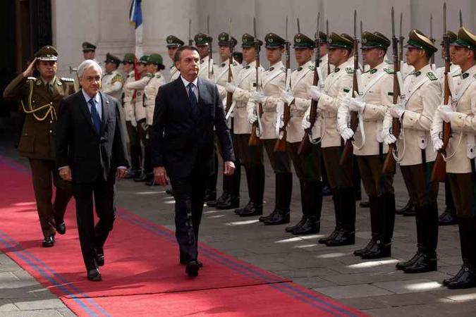 Acordo defendido por Jair Bolsonaro e Sebastian Piñera prevê eliminação de tarifas de importação no intercâmbio de bens(foto: Claudio Reys/AFP) Acordo defendido por Jair Bolsonaro e Sebastian Piñera prevê eliminação de tarifas de importação no intercâmbio de bens(foto: Claudio Reys/AFP)