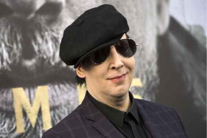 O cantor Marilyn Manson demitiu o baixista acusado de estuprar a namorada(foto: AFP/VALERIE MACON ) O cantor Marilyn Manson demitiu o baixista acusado de estuprar a namorada(foto: AFP/VALERIE MACON )