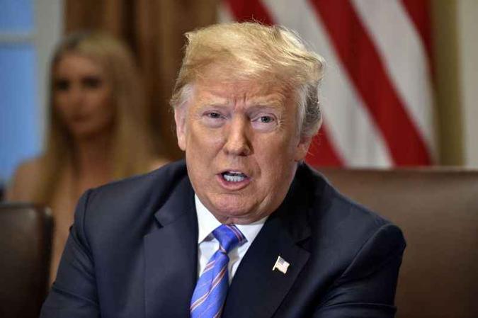 Trump disse que aceitou a conclusão da comunidade de inteligência dos EUA de que a interferência do Kremlin realmente ocorreu(foto: Nicholas Kamm/AFP) Trump disse que aceitou a conclusão da comunidade de inteligência dos EUA de que a interferência do Kremlin realmente ocorreu(foto: Nicholas Kamm/AFP)