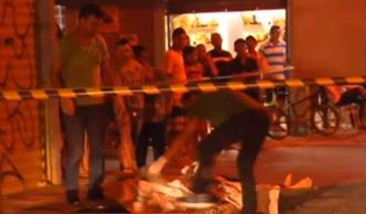 Homem foi morto com sete facadas e três tiros(foto: Divulgação/TV Brasília) Homem foi morto com sete facadas e três tiros(foto: Divulgação/TV Brasília)