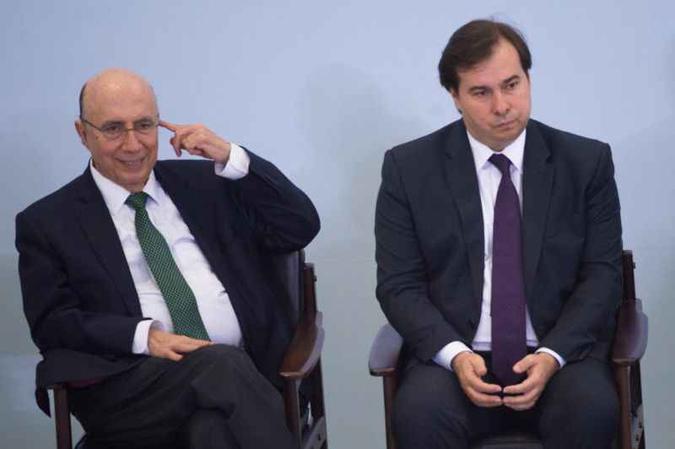 Ministro da Fazenda e presidente da Câmara não escondem mais a disputa pelo mote da campanha de outubro(foto: Andressa Anholete/AFP) Ministro da Fazenda e presidente da Câmara não escondem mais a disputa pelo mote da campanha de outubro(foto: Andressa Anholete/AFP)