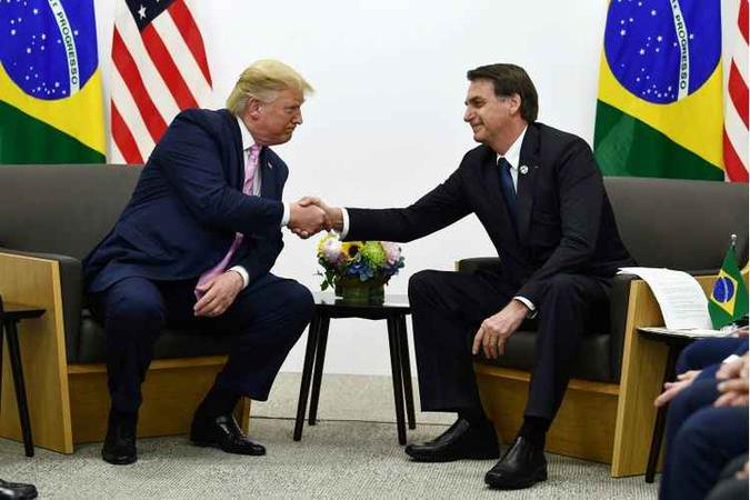 Trump e Bolsonaro conversaram algumas vezes sobre a entrada do Brasil no ''clube dos ricos''(foto: Brendan Smialowski / AFP) Trump e Bolsonaro conversaram algumas vezes sobre a entrada do Brasil no ''clube dos ricos''(foto: Brendan Smialowski / AFP)