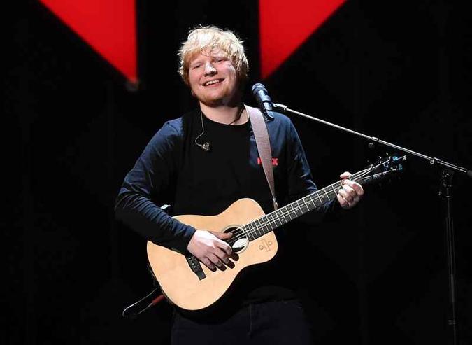 Ed Sheeran conheceu Cherry Seaborn na escola, aos 11 anos de idade(foto: AFP / ANGELA WEISS) Ed Sheeran conheceu Cherry Seaborn na escola, aos 11 anos de idade(foto: AFP / ANGELA WEISS)