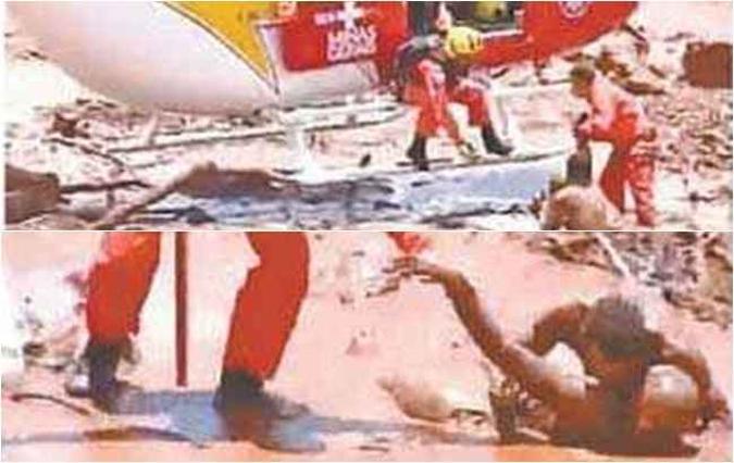 Talita, com o corpo todo coberto de lama, é resgatada após o rompimento da barragem(foto: TV Record/Reprodução) Talita, com o corpo todo coberto de lama, é resgatada após o rompimento da barragem(foto: TV Record/Reprodução)
