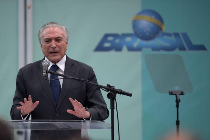 Temer: a aposta de interlocutores é que o presidente vai virar o ano em um outro patamar na corrida eleitoral (foto: AFP / Mauro PIMENTEL) Temer: a aposta de interlocutores é que o presidente vai virar o ano em um outro patamar na corrida eleitoral (foto: AFP / Mauro PIMENTEL)