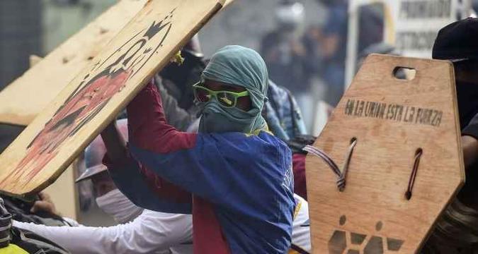Cenas dos protestos de sexta-feira na Venezuela(foto: Ronaldo Schemidt/AFP) Cenas dos protestos de sexta-feira na Venezuela(foto: Ronaldo Schemidt/AFP)