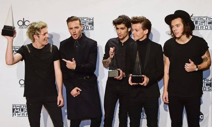 Banda One Direction esteve entre as mais tocadas(foto: AFP PHOTO/FREDERIC J. BROWN ) Banda One Direction esteve entre as mais tocadas(foto: AFP PHOTO/FREDERIC J. BROWN )