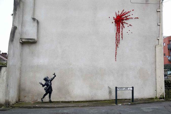 A obra origina de Bansky, inaugurada em 14 de fevereiro(foto: Geoff Caddick/AFP) A obra origina de Bansky, inaugurada em 14 de fevereiro(foto: Geoff Caddick/AFP)