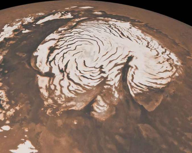 Gelo no polo norte de Marte: a análise de registros feitos pela sonda Mars Reconnaissance Orbiter permite traçar uma história do clima da região(foto: AFP) Gelo no polo norte de Marte: a análise de registros feitos pela sonda Mars Reconnaissance Orbiter permite traçar uma história do clima da região(foto: AFP)