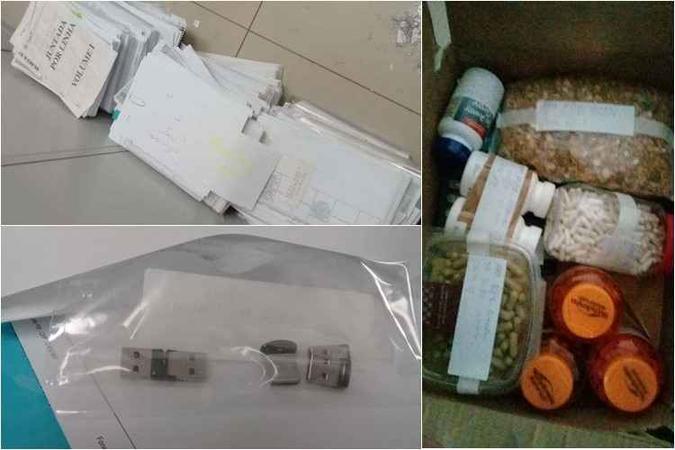A polícia encontrou documentos de empresas de Luiz Estevão, pen-drives, remédios, chocolates e uma tesoura durante a Operação Bastilha: privilégio no Complexo Penitenciário da Papuda(foto: Divulgação/PCDF) A polícia encontrou documentos de empresas de Luiz Estevão, pen-drives, remédios, chocolates e uma tesoura durante a Operação Bastilha: privilégio no Complexo Penitenciário da Papuda(foto: Divulgação/PCDF)