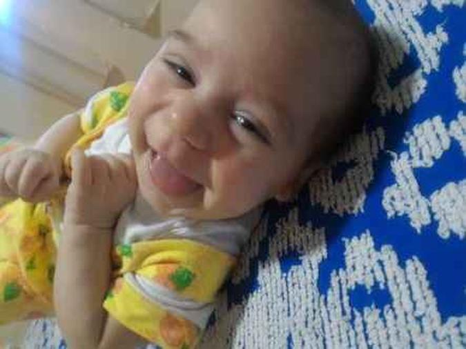 Michel Salustiano Silva, de 6 meses, foi atingido por um tiro e morreu(foto: Arquivo Pessoal) Michel Salustiano Silva, de 6 meses, foi atingido por um tiro e morreu(foto: Arquivo Pessoal)
