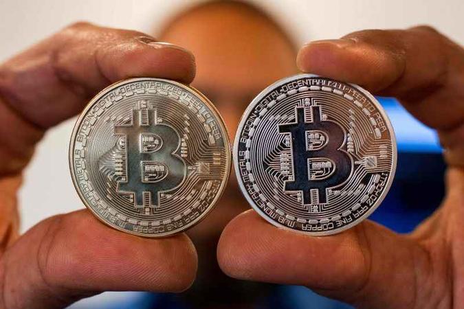 As criptomoedas são uma novidade que assustou pela recente valorização. O caso mais emblemático é o Bitcoin(foto: Jack Guez/AFP) As criptomoedas são uma novidade que assustou pela recente valorização. O caso mais emblemático é o Bitcoin(foto: Jack Guez/AFP)