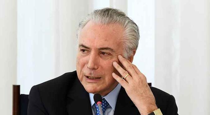 Temer disse que após a aprovação da previdência, seu governo promoverá uma simplificação tributária no país.(foto: AFP / EVARISTO SA) Temer disse que após a aprovação da previdência, seu governo promoverá uma simplificação tributária no país.(foto: AFP / EVARISTO SA)