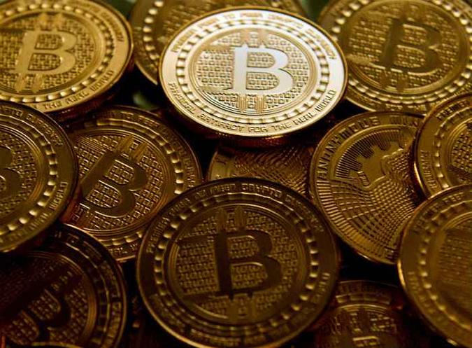 O bitcoin foi a primeira criptomoeda criada(foto: Karen Bleier/AFP ) O bitcoin foi a primeira criptomoeda criada(foto: Karen Bleier/AFP )