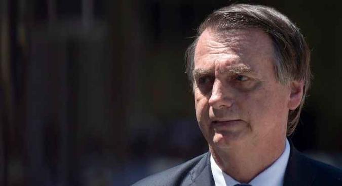 Presidente Jair Bolsonaro (PSL), no Rio de Janeiro, durante evento em comemoração aos 211 anos do Corpo de Fuzileiros Navais(foto: Mauro Pimentel/AFP) Presidente Jair Bolsonaro (PSL), no Rio de Janeiro, durante evento em comemoração aos 211 anos do Corpo de Fuzileiros Navais(foto: Mauro Pimentel/AFP)