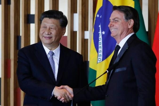 Xi Jinping, com Jair Bolsonaro, ao fim do encontro bilateral: para o presidente brasileiro, a China Xi Jinping, com Jair Bolsonaro, ao fim do encontro bilateral: para o presidente brasileiro, a China