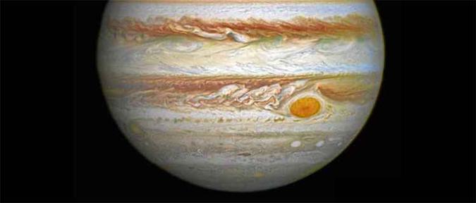 Júpiter e a grande mancha, no canto inferior direito do planeta: emissão de ondas sonoras que geram calor(foto: Nasa/AFP ) Júpiter e a grande mancha, no canto inferior direito do planeta: emissão de ondas sonoras que geram calor(foto: Nasa/AFP )