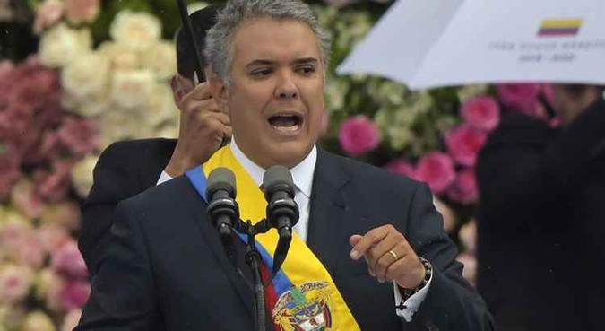 Duque, que cumprirá um mandato de quatro anos, é afilhado político do ex-presidente Álvaro Uribe(foto: AFP) Duque, que cumprirá um mandato de quatro anos, é afilhado político do ex-presidente Álvaro Uribe(foto: AFP)
