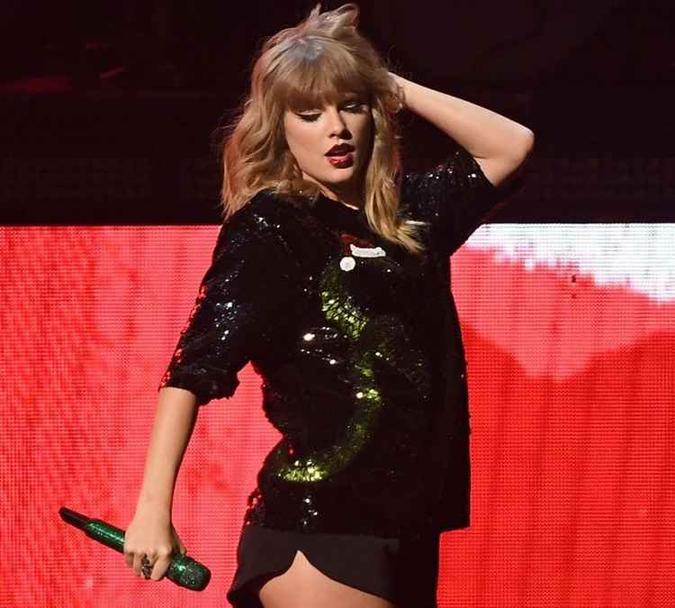 Para Taylor Swift, o que fica é uma boa reputação em vendas(foto: ANGELA WEISS) Para Taylor Swift, o que fica é uma boa reputação em vendas(foto: ANGELA WEISS)