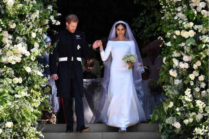 Meghan Markle, duquesa de Sussex, se casou usando um vestido liso, da marca Givenchy, em maio de 2018. A pegada minimalista tem crescido cada vez mais entre as noivas. (foto: BEN STANSALL ) Meghan Markle, duquesa de Sussex, se casou usando um vestido liso, da marca Givenchy, em maio de 2018. A pegada minimalista tem crescido cada vez mais entre as noivas. (foto: BEN STANSALL )