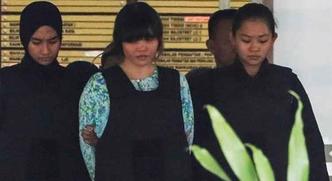 A vietnamita Doan Thi Huong, uma das acusadas do assassinato de Kim Jong-Nam, é escoltada pela poíícia malaia até o tribunal(foto: EFE/ Fazry Ismail) A vietnamita Doan Thi Huong, uma das acusadas do assassinato de Kim Jong-Nam, é escoltada pela poíícia malaia até o tribunal(foto: EFE/ Fazry Ismail)