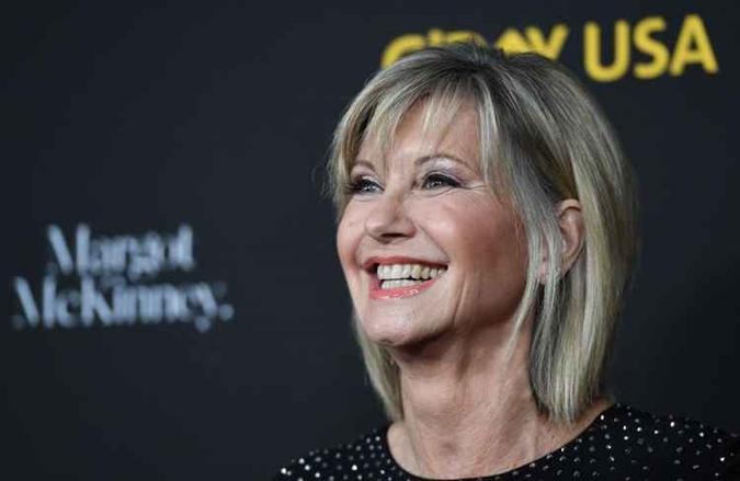 Atriz é lembrada por ter protagonizado o musical Grease.(foto: AFP/Robyn Beck) Atriz é lembrada por ter protagonizado o musical Grease.(foto: AFP/Robyn Beck)