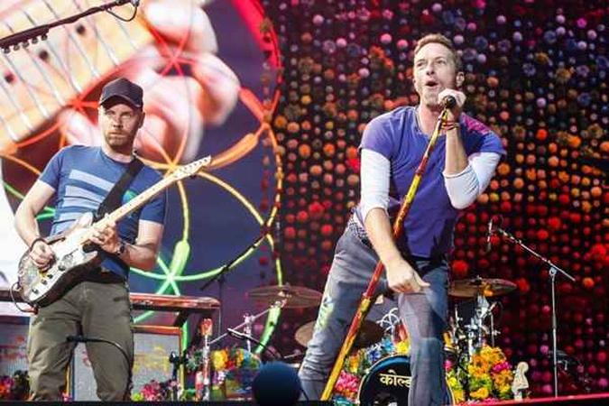 A banda Coldplay faz três shows no Brasil da turnê 'A head full of dreams'(foto: AFP/GEOFFROY VAN DER HASSELT) A banda Coldplay faz três shows no Brasil da turnê 'A head full of dreams'(foto: AFP/GEOFFROY VAN DER HASSELT)