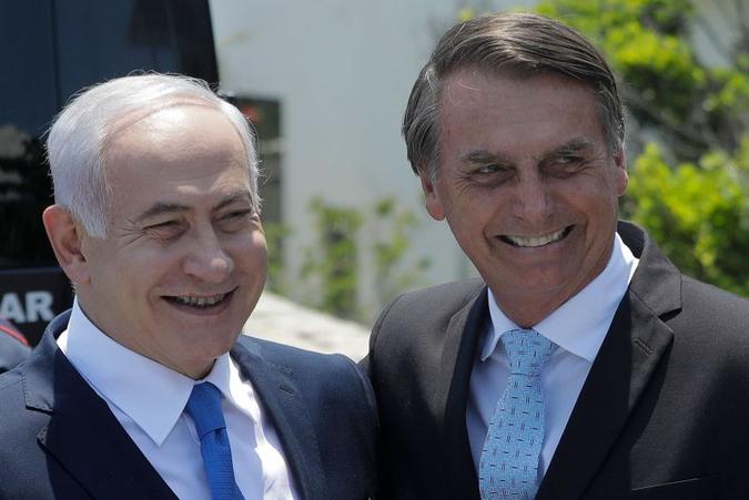 Netanyahu, ao lado de Bolsonaro: 'Israel é a terra prometida. E o Brasil é terra da promessa'(foto: Leo Correa/AFP) Netanyahu, ao lado de Bolsonaro: 'Israel é a terra prometida. E o Brasil é terra da promessa'(foto: Leo Correa/AFP)