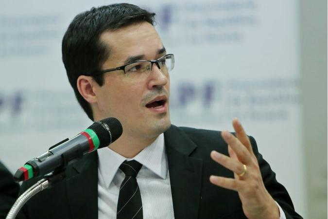 O procurador da República Deltan Dallagnol encabeçou a coletiva da Operação Lava-Jato(foto: Heuler Andrey/AFP) O procurador da República Deltan Dallagnol encabeçou a coletiva da Operação Lava-Jato(foto: Heuler Andrey/AFP)