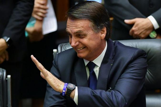 Em 2016, Bolsonaro gravou um vídeo em que pede votos para o candidato que classificou como 'meu amigo particular'(foto: Nelson Almeida/AFP) Em 2016, Bolsonaro gravou um vídeo em que pede votos para o candidato que classificou como 'meu amigo particular'(foto: Nelson Almeida/AFP)