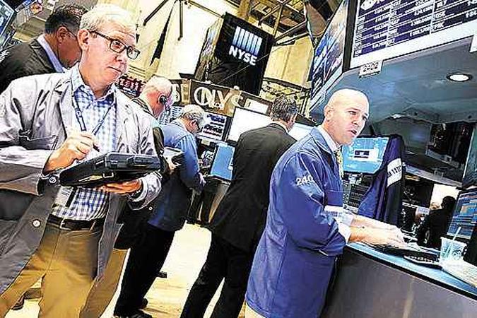 Operadores da Bolsa de Nova York assistem ao discurso da presidente do Fed: mercado fecha em baixa de 0,22% (foto: Spencer Platt/AFP) Operadores da Bolsa de Nova York assistem ao discurso da presidente do Fed: mercado fecha em baixa de 0,22% (foto: Spencer Platt/AFP)